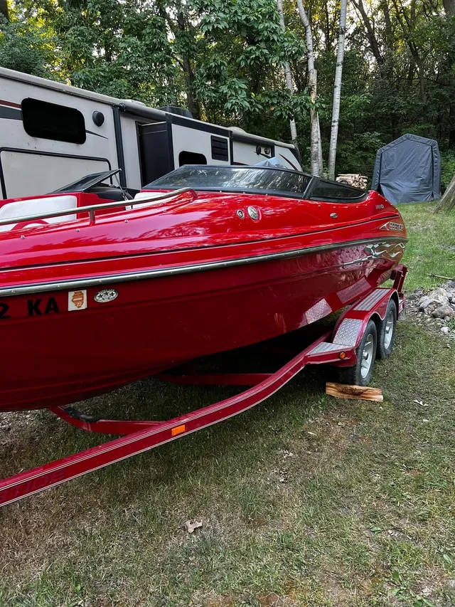 Bright red bowrider boat detailed to a mirror shine